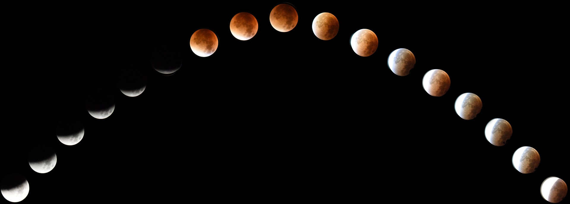 Partial lunar eclipse and supermoon on September 17, 2024, as seen in the night sky, with a subtle shadow covering part of the moon and Saturn nearby